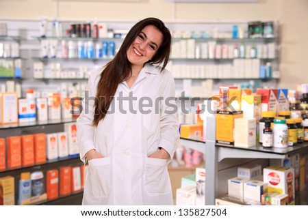 pretty young  pharmacist on a pharmacy store