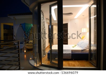 luxury suite with bed inside and outside the room