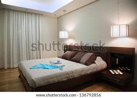 luxury bedroom with modern wooden furniture