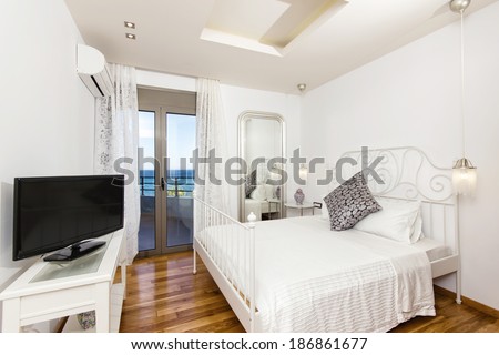 interior of a luxury bedroom with a beautiful sea view