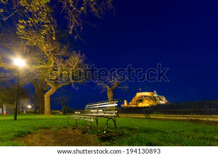 park at night with view of the old fort in Corfu island of Greece