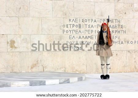The Greek Presidential guard called Tsoliades dressed in traditional uniform at the monument of the unknown soldier in front of the Greek  parliament. May 11th 2014 Athens