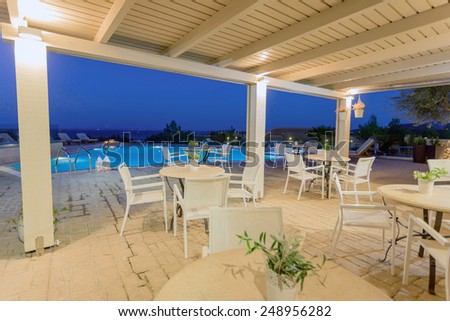 big luxury pool at night in a summer resort in Greece