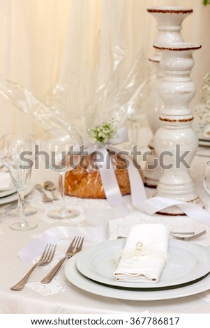 fancy table set for wedding decorated with flowers
