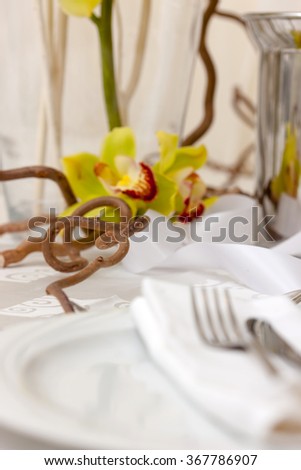 fancy table set for wedding decorated with flowers