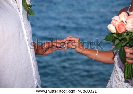 stock photo Bride and groom change rings on their wedding ceremony