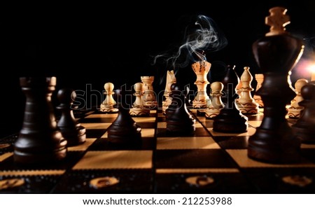 Concept, Chess Game Raging On with Firing Smoke, Black Background