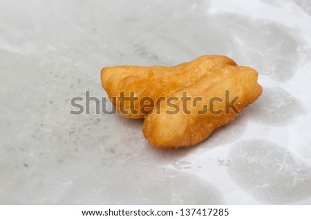 Deep fried dough stick put on oil blotting paper
