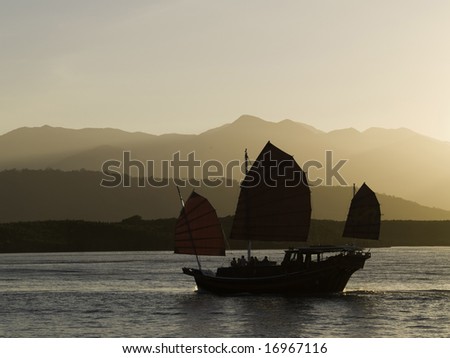 An oriental sunset cruise coming back into port.