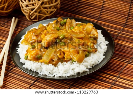 Chicken Curry with boiled rice a popular chinese food available at take aways