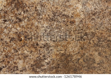 Stone Background of mottled granite igneous rock used for kitchen worktops etc