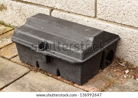 Enclosed Rat trap for laying poison to kill small mammals without the risk of harming larger animals used by pest control services