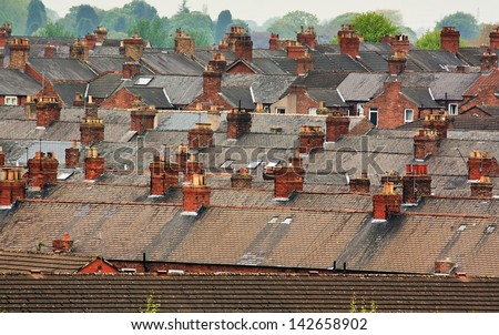 Urban Scene Across Built Up Residential Area Of Terraced Houses Showing The Slate Roof Tops Of An Old Housing Estate