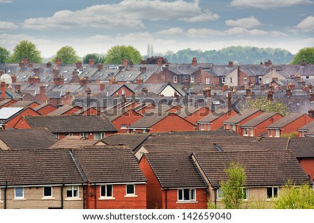 Urban Scene Across Built Up Area Showing The Slate Roof Tops Of Terraced Houses On An Old Housing Estate