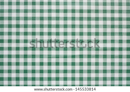 Green gingham tablecloth often found in diners and cafes a popular traditional covering for tables where food is consumed