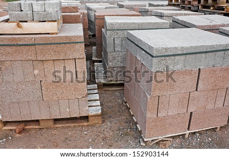skids of breeze blocks at a builders supplies yard also known as cinder blocks in the us or Concrete masonry units