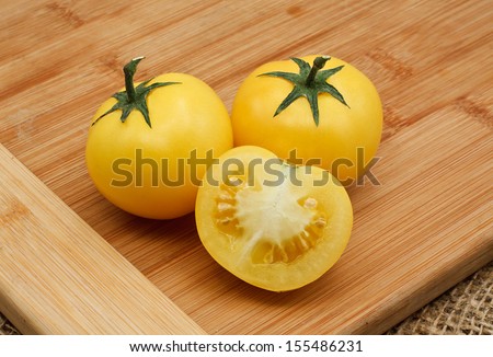 homegrown Yellow tomato harvest from a greenhouse, vegetable produce grown by a keen gardener