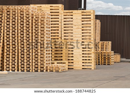 Stock Piles of wooden pallets in a yard ready for breaking up and recycling into firewood or kindling