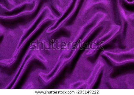Purple Silk background texture with loose folds making a royal wavy pattern