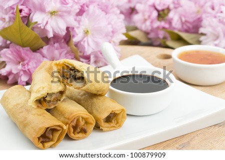 Spring Rolls - Fried duck spring rolls served with soy sauce and sweet chili sauce.
