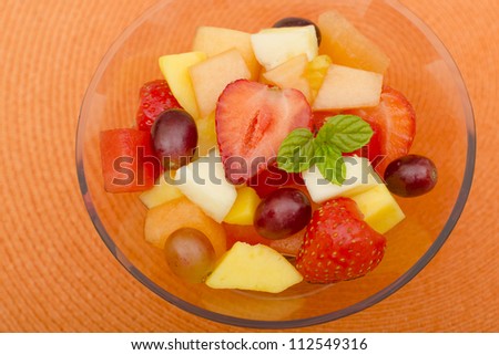 Fruit Salad - A colourful variety of fruit in a glass bowl. Refreshing light meal!
