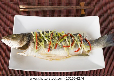 Steamed Fish - Chinese style steamed sea bass garnished with ginger, chili and spring onions.