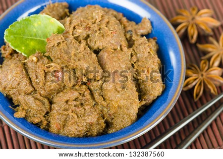 Rendang Daging - Dried beef curry with coconut milk and spices. Traditional Indonesia, Malaysian and Singaporean dish.