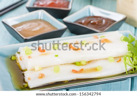Cheong Fun - Chinese steamed rice rolls with dried shrimp and spring onion served with hoisin sauce, soybean paste and chili dip. Dim Sum / Yum Cha.