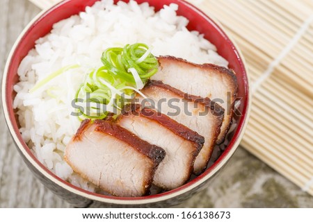 Char Siu Pork - Chinese roasted pork loin served in a bowl of steamed rice.