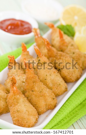 Breaded Butterfly Prawns - Deep fried battered prawns filled with garlic sauce served with chili sauce and garlic mayo.