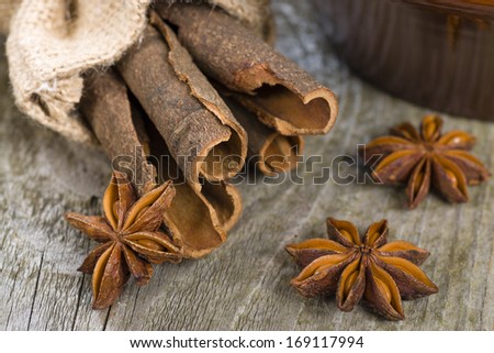 Cassia Bark & Star Anise - Close up of cassia bark and star anise on a rustic background.