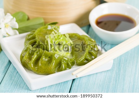 Jiaozi- Oriental vegetable chive dumplings served with a soy based dipping sauce.