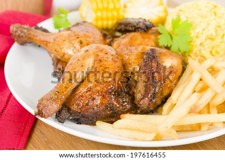 Piri Piri Chicken -  Spatchcocked poussin grilled with piri piri sauce served with fries, rice and corn on the cob.