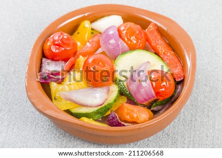 Mediterranean Roasted Vegetables - Pepper, tomatoes, red onions and courgette roasted with olive oil and served in a cazuela.