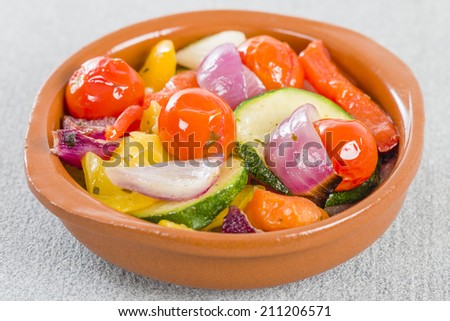 Mediterranean Roasted Vegetables - Pepper, tomatoes, red onions and courgette roasted with olive oil and served in a cazuela.