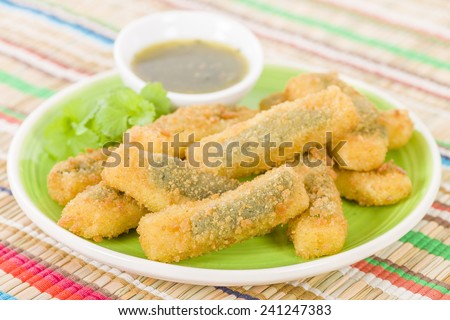 Stuffed Jalapenos - Green chilies filled with cheese, breaded and deep fried. Served with jalapeno relish.