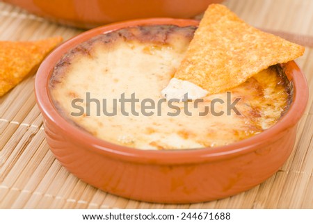 Baked Cheese - Melted cheese dip served with tortilla chips.