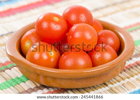 Cherry Tomatoes - Fresh cherry tomatoes in a earthenware bowl