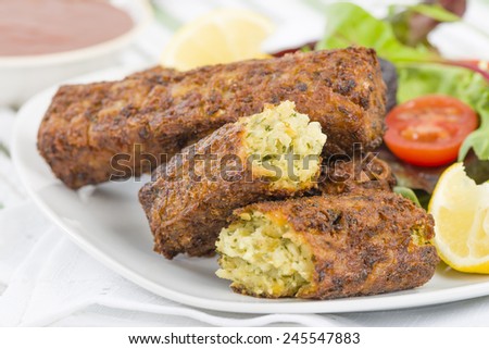 Vegetarian Sausage - Bubble and squeak sausages with salad and chili sauce.