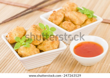 Chicken Nuggets - Battered and deep fried chicken pieces served with chilli sauce.