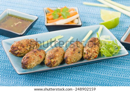 Nem Nuong Xa - Vietnamese minced pork sausages on lemongrass skewers served do chua, nouc cham and chili sauce.