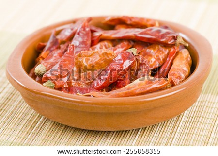 Red Dried Chillies - Dry chillies in an earthenware bowl.
