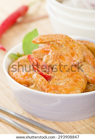 Thai Prawn Curry - King prawns in red curry sauce and coconut milk in a lilac bowl.
