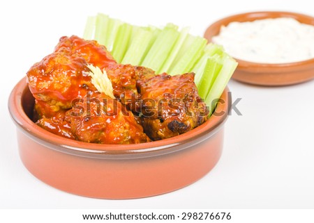 Buffalo Wings - Hot and spicy buffalo chicken wings with celery and cheese dip.
