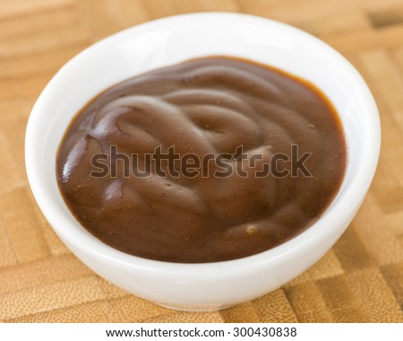 Chocolate Sauce - Bowl of chocolate dip on a wooden background