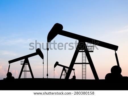 silhouette view of Oil pumps and sun rise. Oil industry equipment.