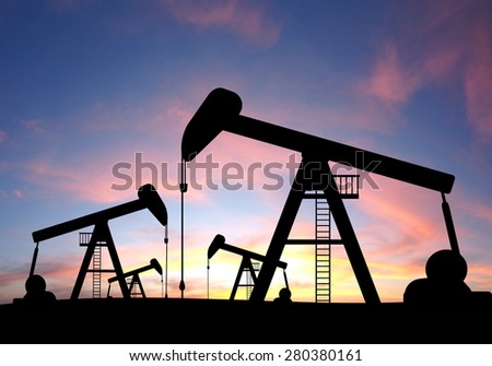 silhouette view of Oil pumps and sunset. Oil industry equipment.
