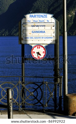 View of Lugano Lake departure signs