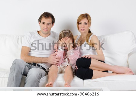 Young family watching tv