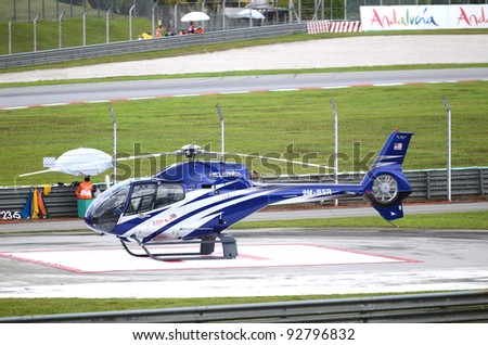 SEPANG, MALAYSIA-OCT.21: A blue helicopter in parking standby during practice session of Shell Advance Malaysian Moto GrandPrix on Oct. 21 2011 in Sepang, Malaysia.